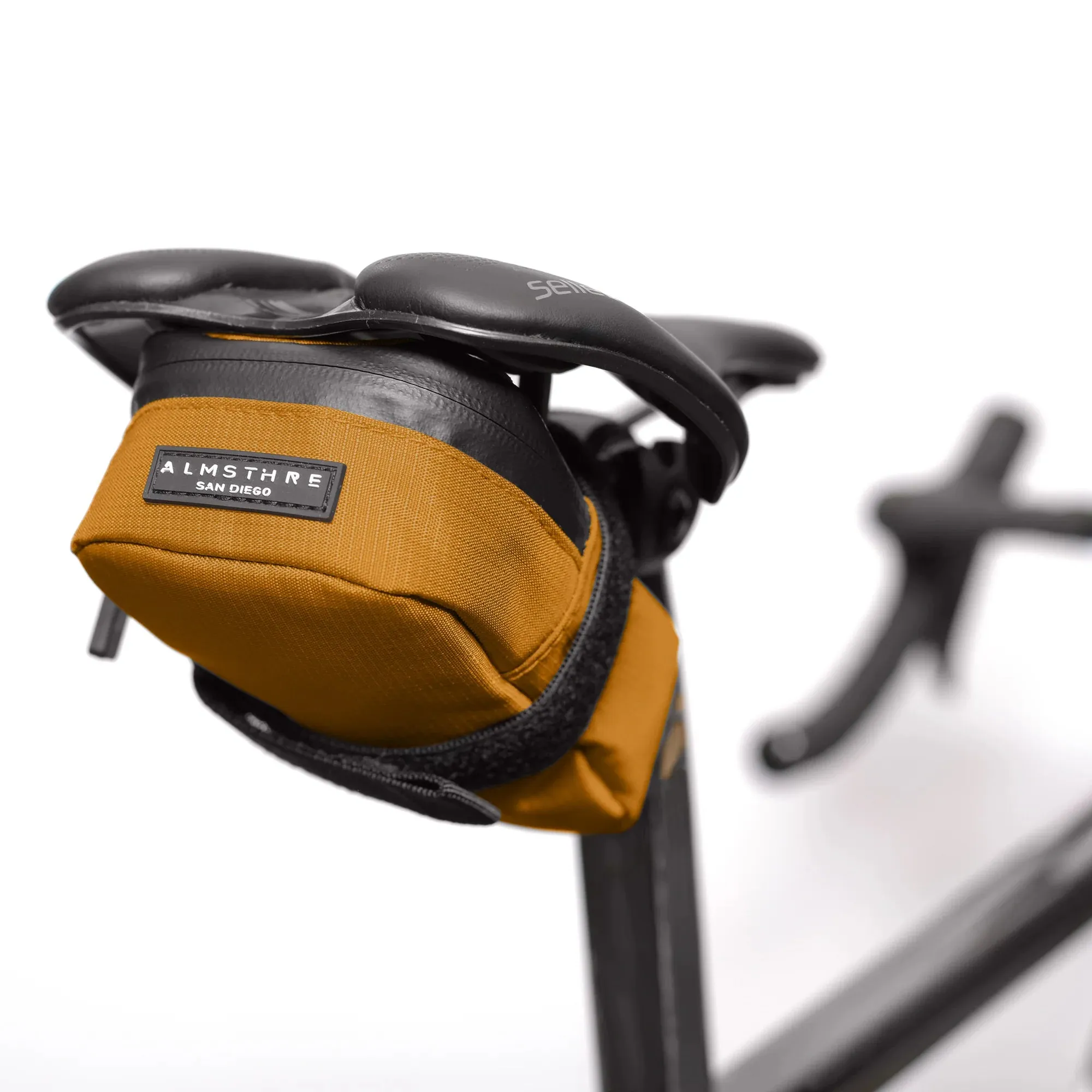almsthre signature saddle bag